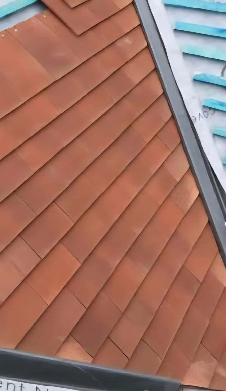 Red clay tile work with fresh mortar verge