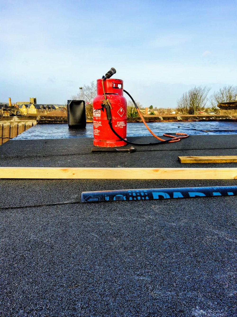 Torch-on felt flat roof in progress