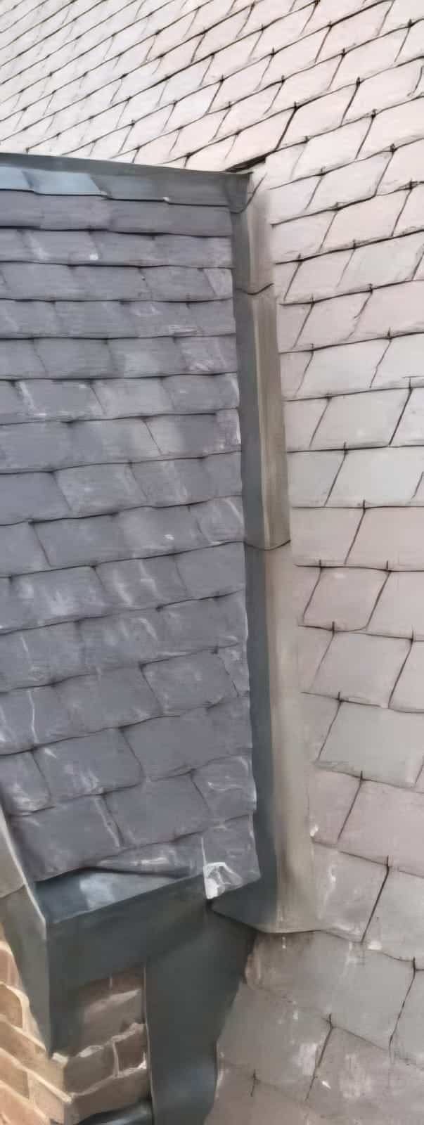 Standing seam detail alongside slate